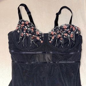 Black/floral lingerie bodysuit.